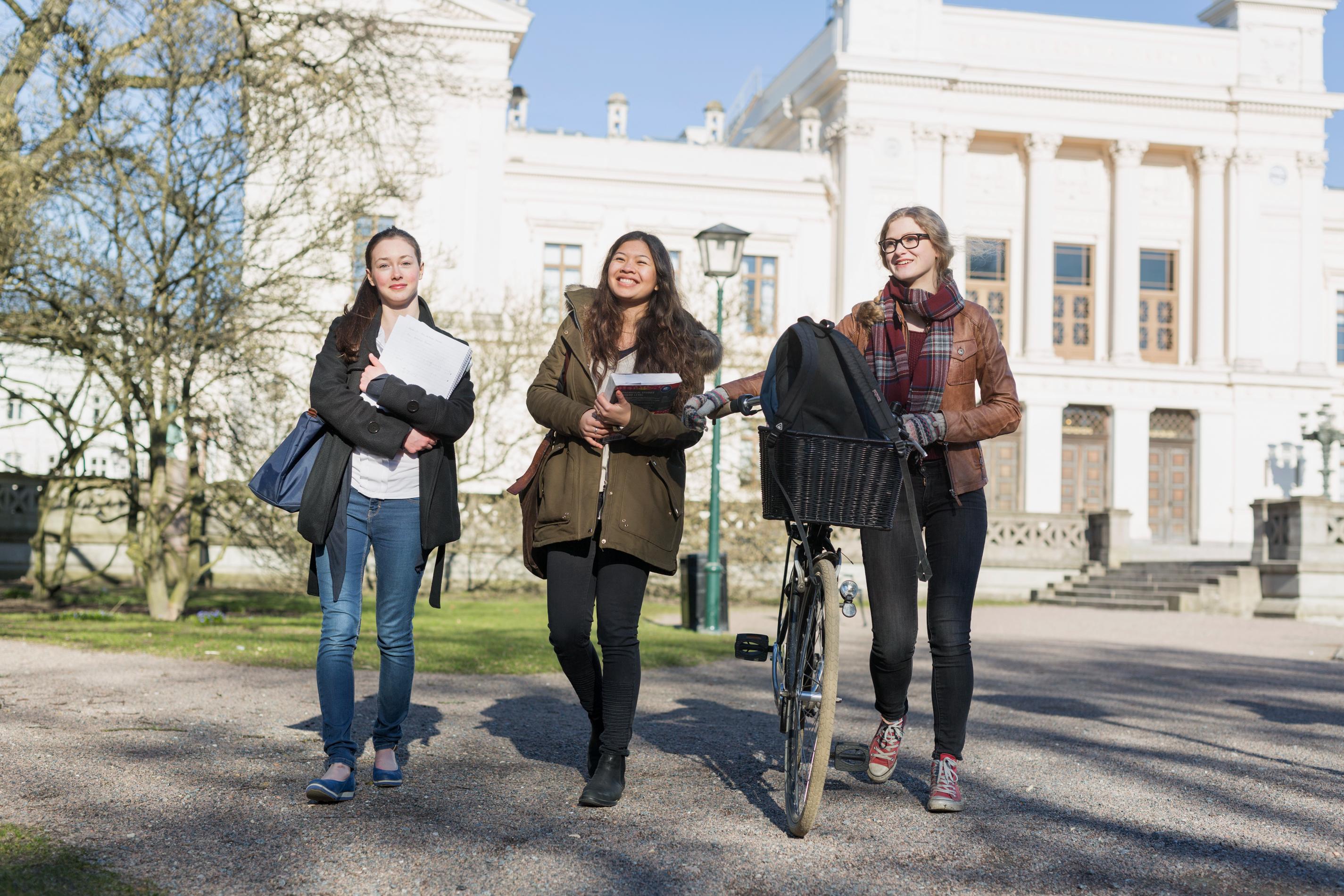 full-length-of-happy-female-students-walking-out-o-2023-11-27-05-02-21-utc (1).jpg