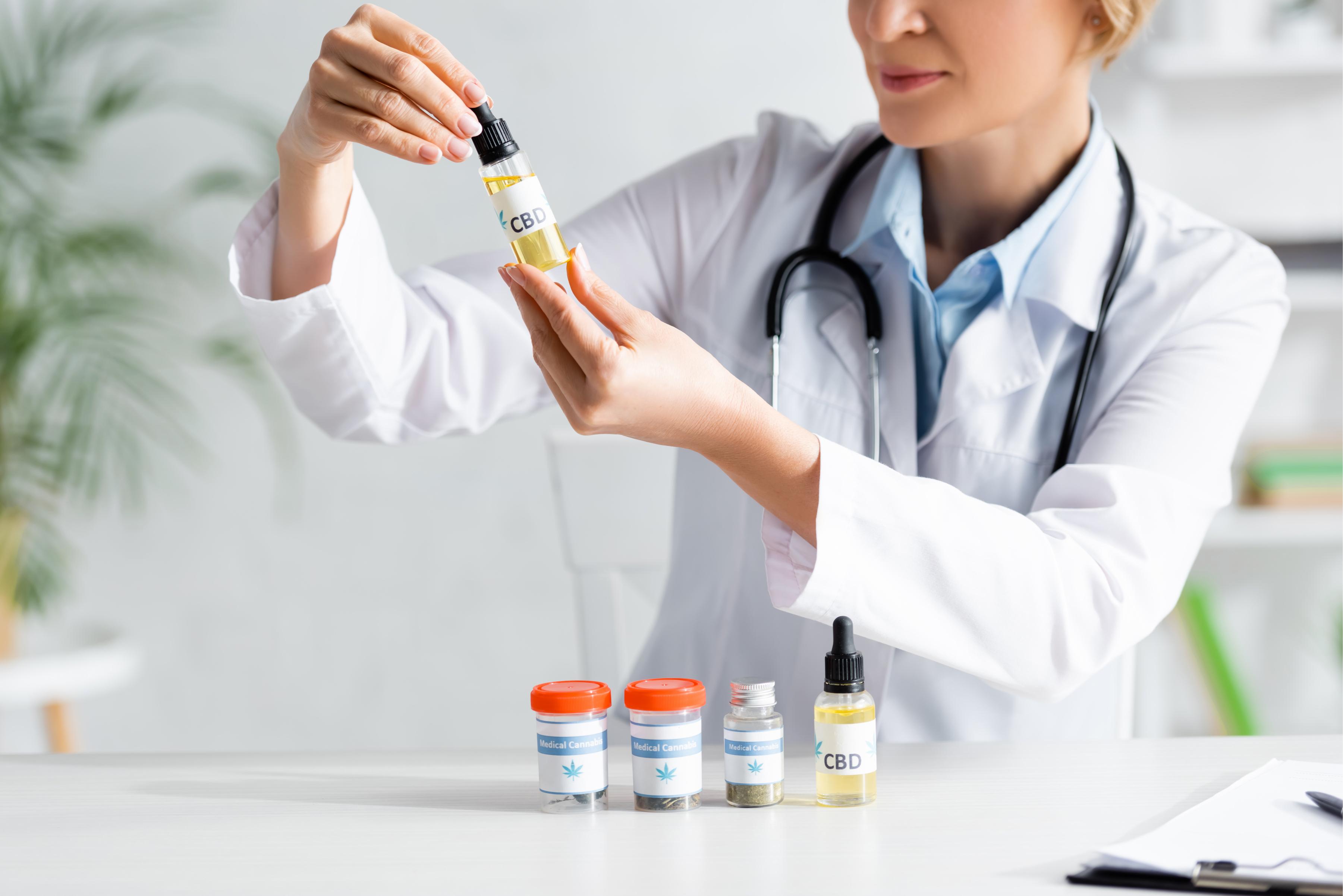 cropped-view-of-doctor-in-white-coat-holding-bottl-2023-11-27-05-04-29-utc (1).jpg
