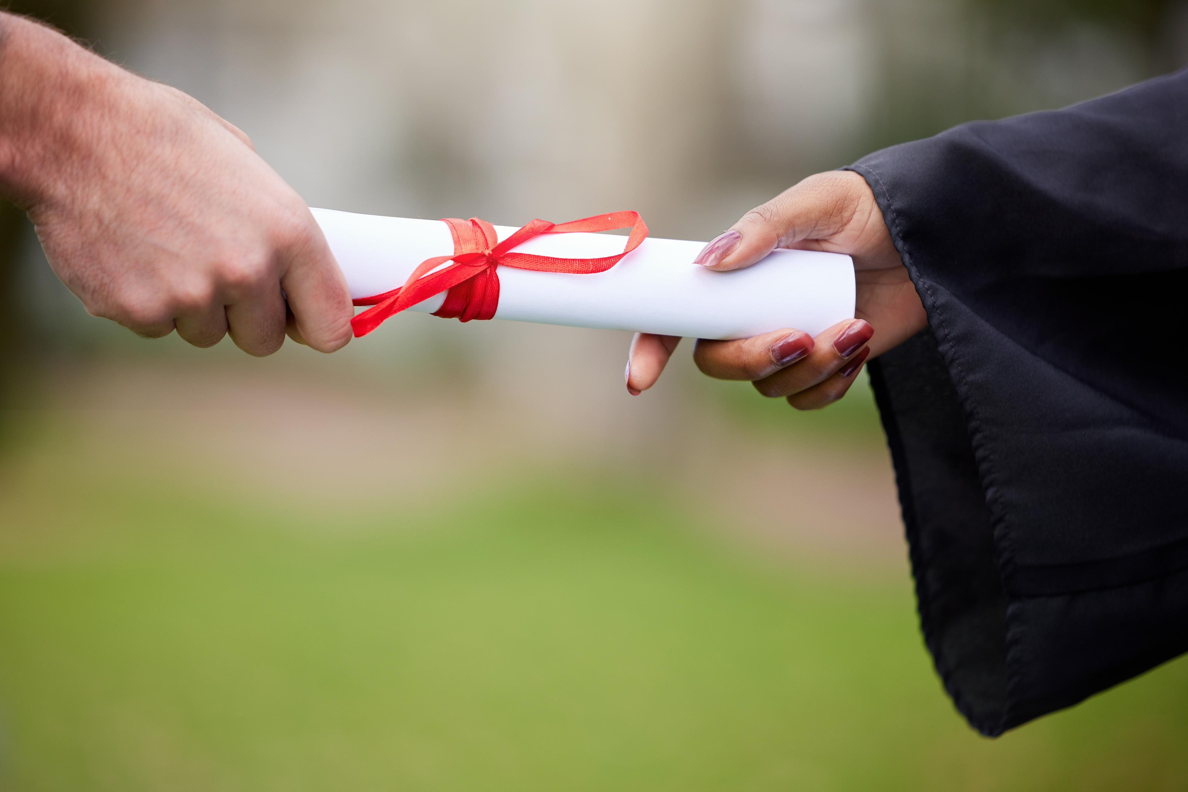 closeup-shot-of-an-unrecognisable-graduate-receivi-2023-11-27-05-14-26-utc (1).jpg