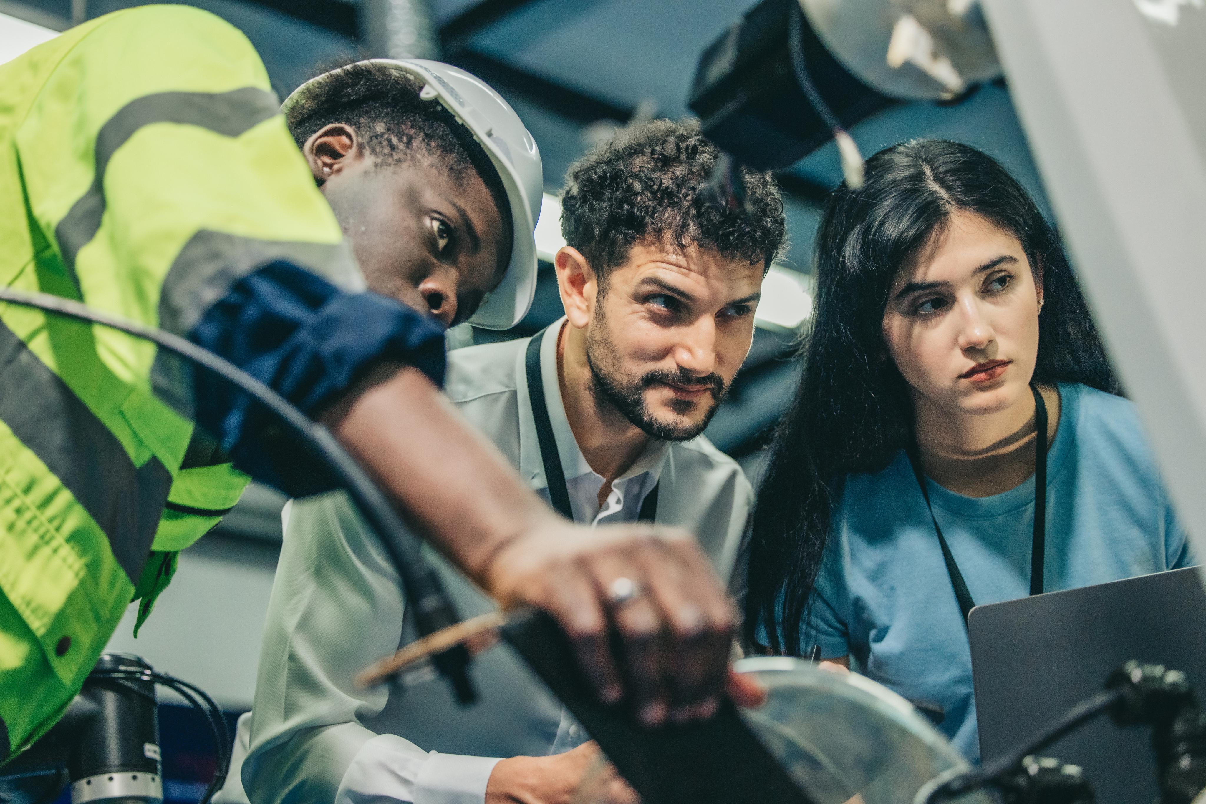 robotic-engineer-and-team-oversee-software-machin-2024-04-03-18-18-52-utc (1).jpg