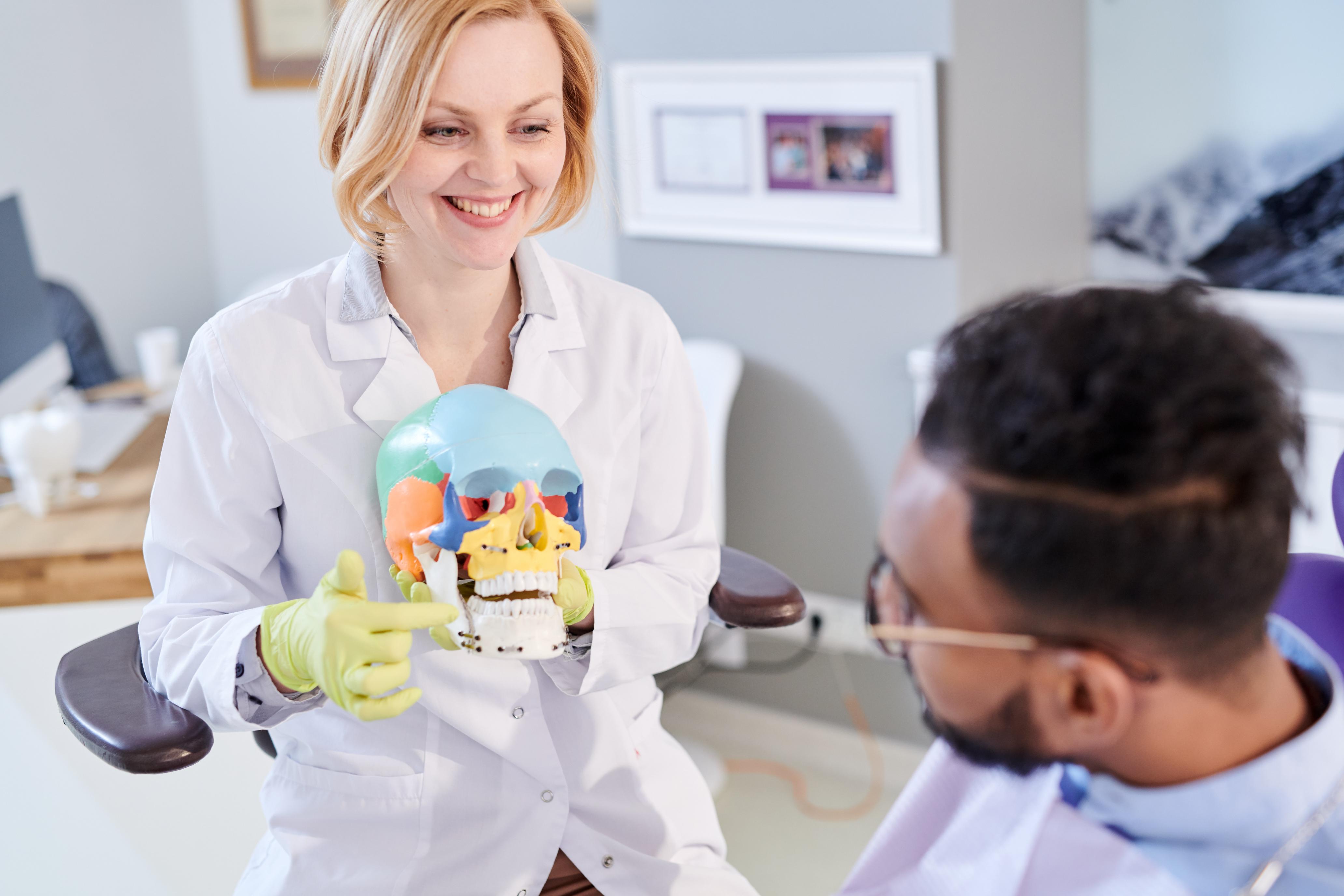 female-dentist-explaining-teeth-structure-2023-11-27-05-28-00-utc (1).jpg