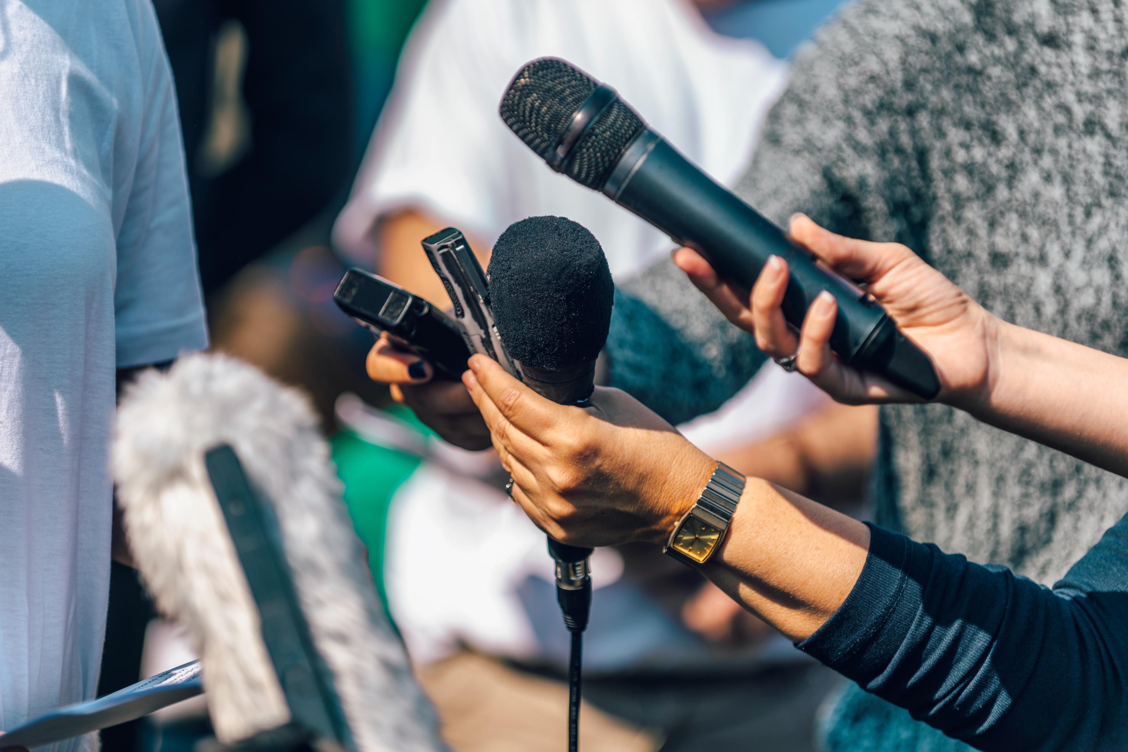 journalists-interviewing-female-speaker-answering-2023-11-27-05-02-39-utc (1).jpg