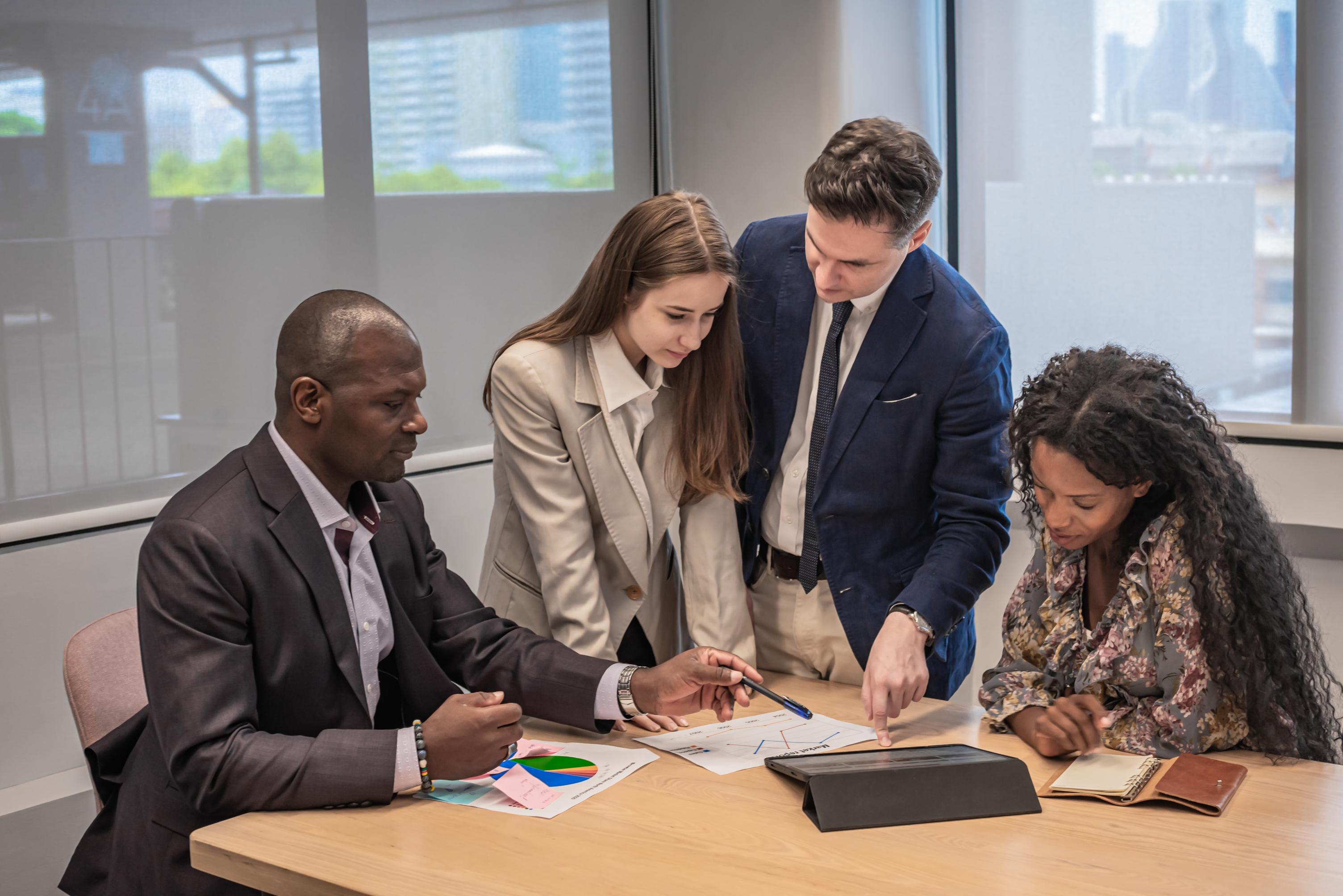 business-people-meeting-and-look-tablet-for-discus-2023-11-27-05-34-40-utc (1).jpg