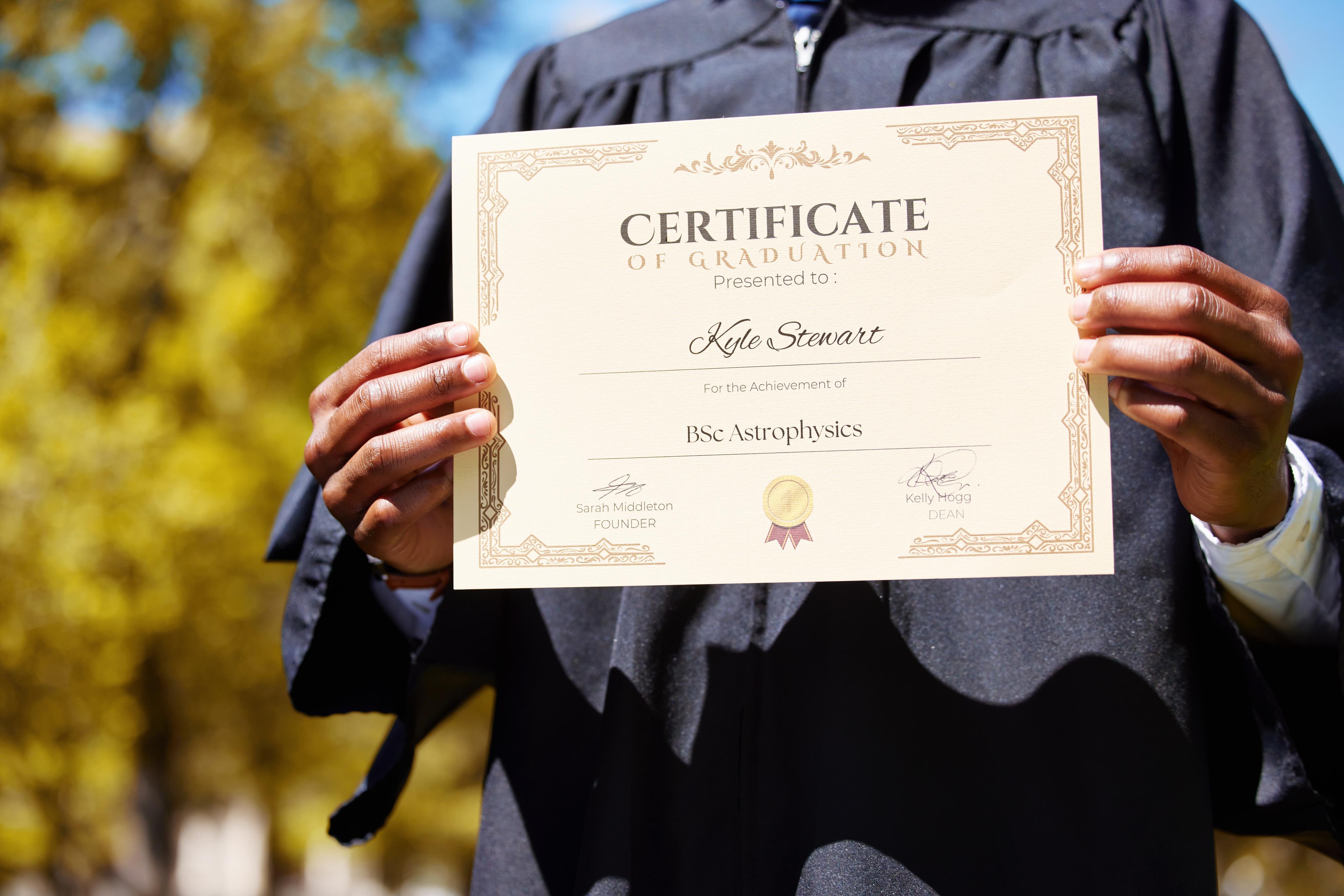 college-hands-and-closeup-of-a-graduation-diploma-2023-11-27-05-03-21-utc (1).jpg
